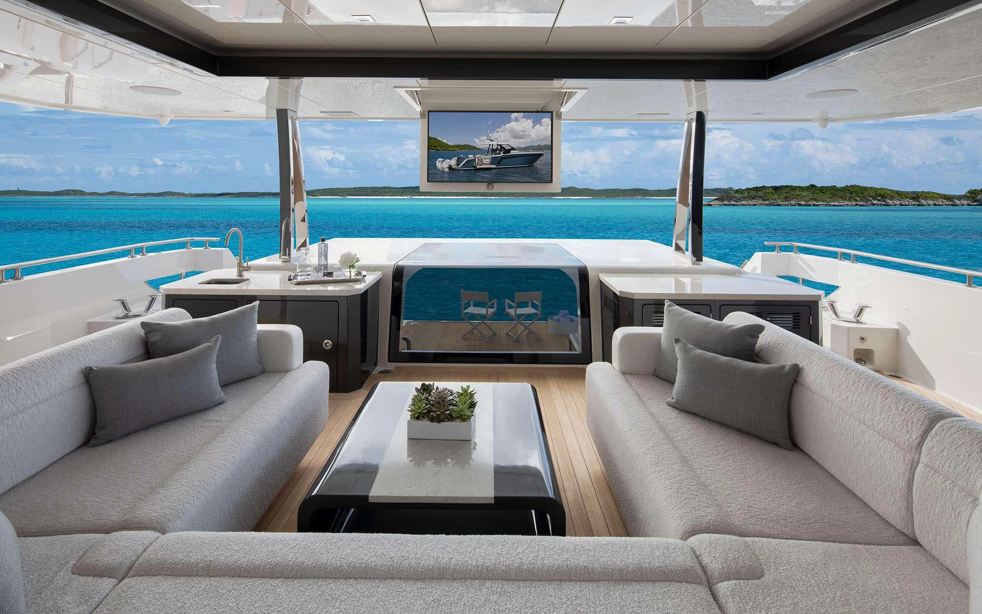 a living room with a couch and a pool aboard ENTREPRENEUR Yacht for Charter