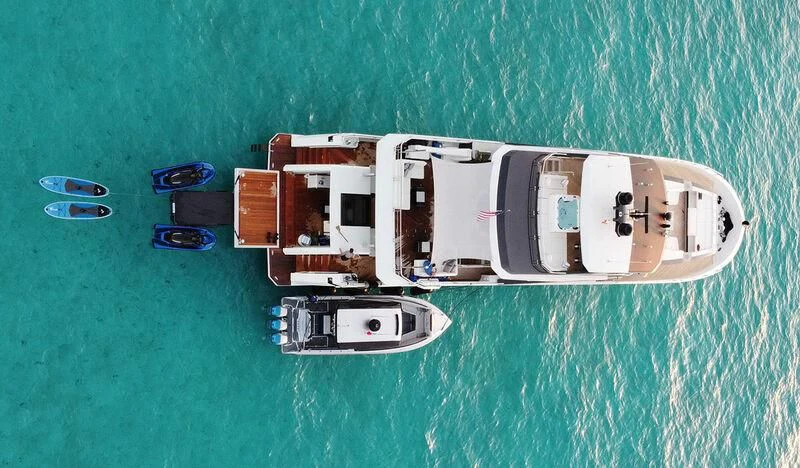a group of white and black objects on a green surface aboard ENTREPRENEUR Yacht for Charter