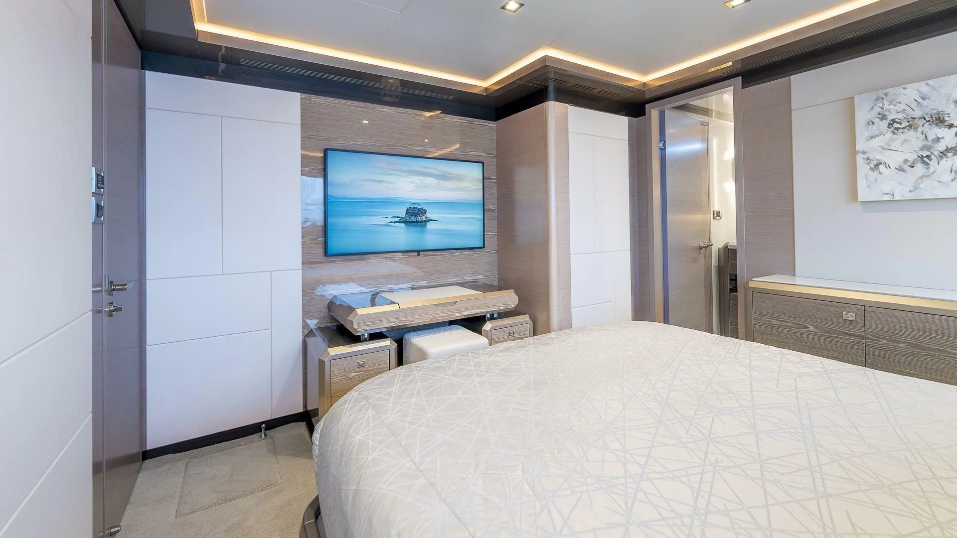 a room with a bed and a television aboard ENTREPRENEUR Yacht for Charter
