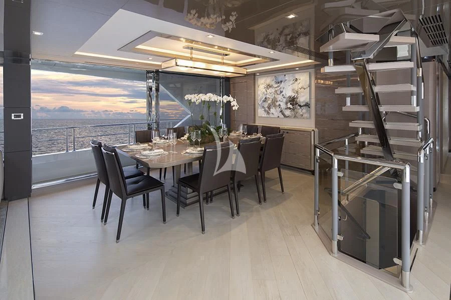 a room with a table and chairs aboard ENTREPRENEUR Yacht for Charter