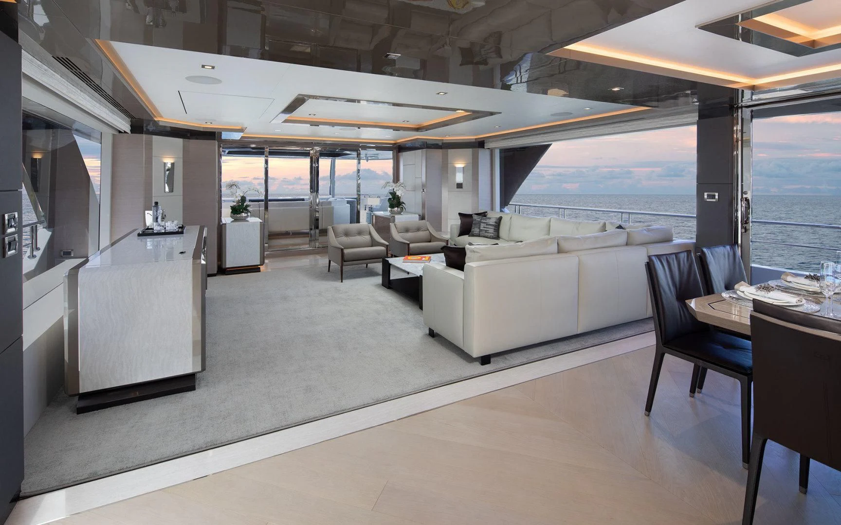 a room with a couch and a table and chairs aboard ENTREPRENEUR Yacht for Charter