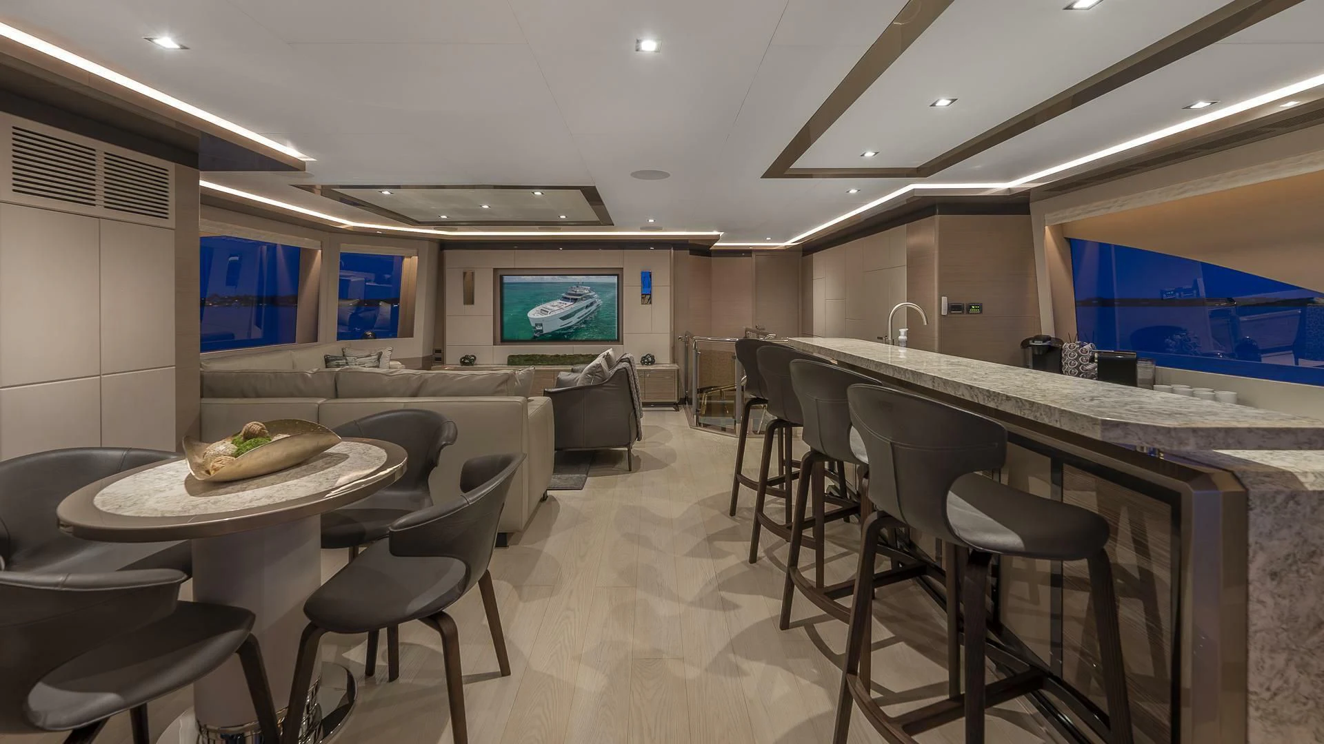 a room with tables and chairs aboard ENTREPRENEUR Yacht for Charter