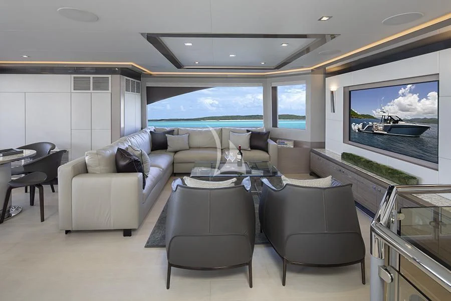 a living room with a large screen aboard ENTREPRENEUR Yacht for Charter
