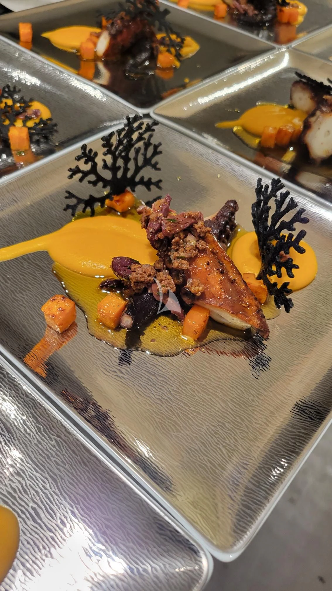 a plate of food aboard ENTREPRENEUR Yacht for Charter