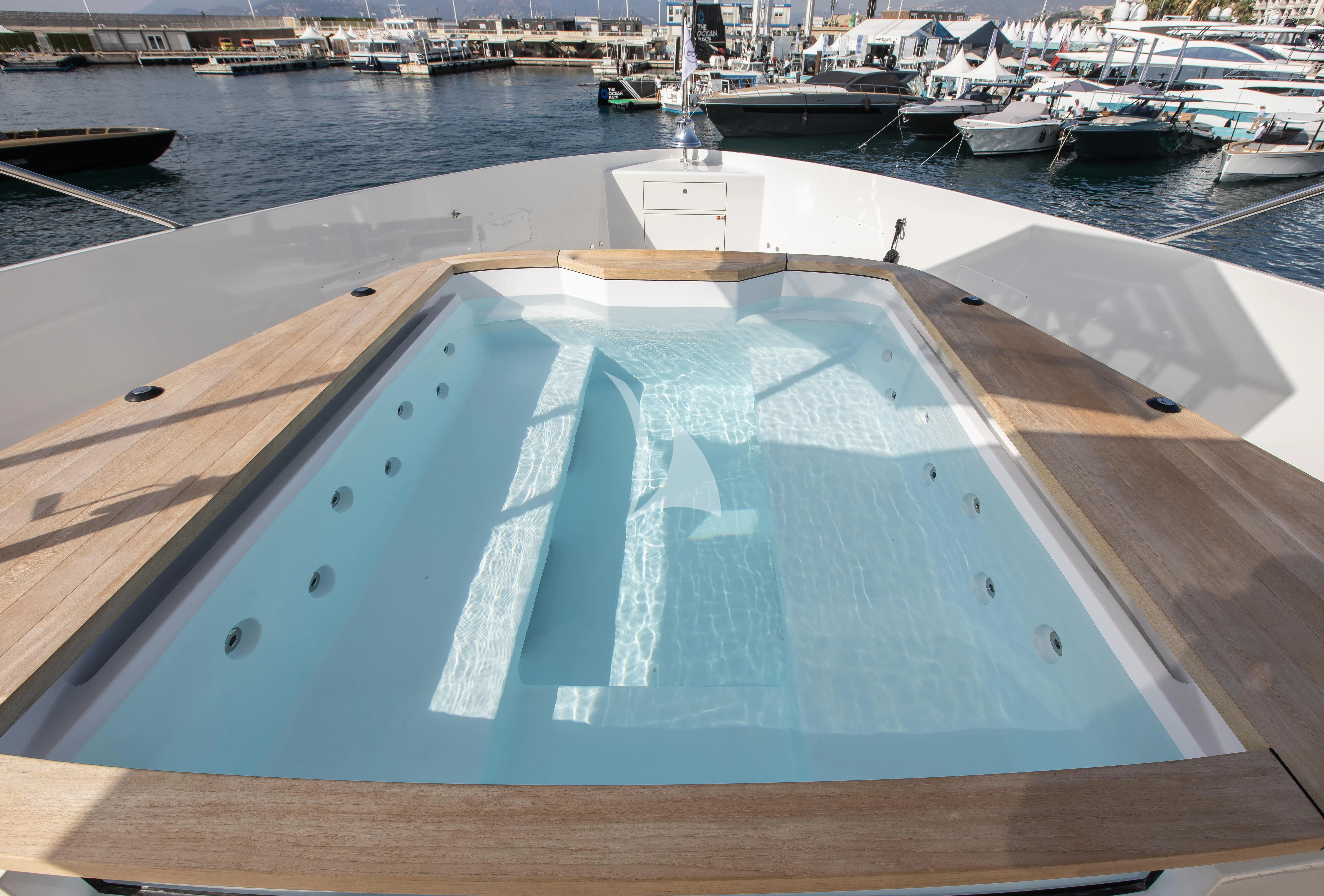 a swimming pool on a boat aboard HAYAT Yacht for Sale