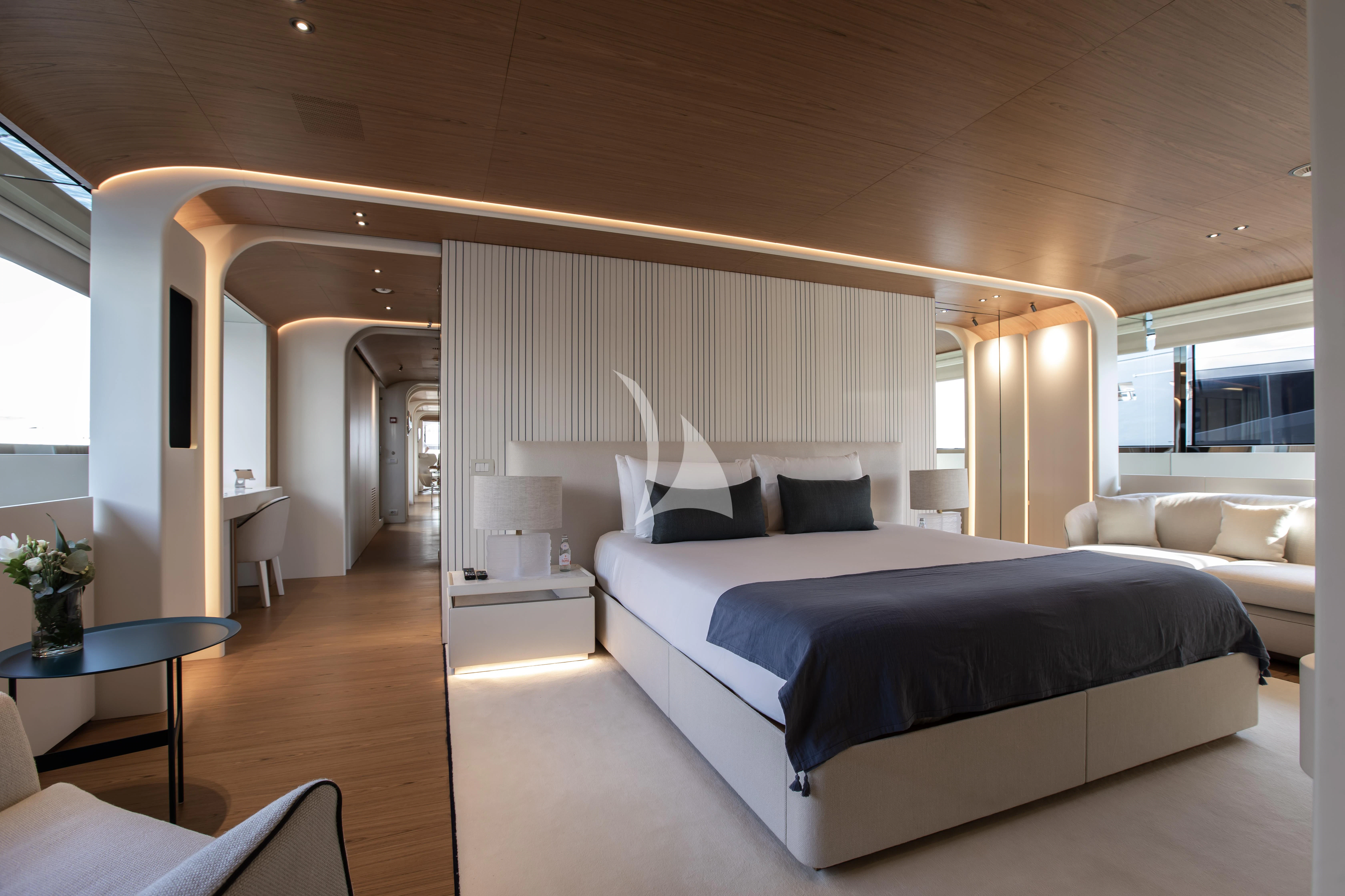 a large bedroom with a bed aboard HAYAT Yacht for Sale