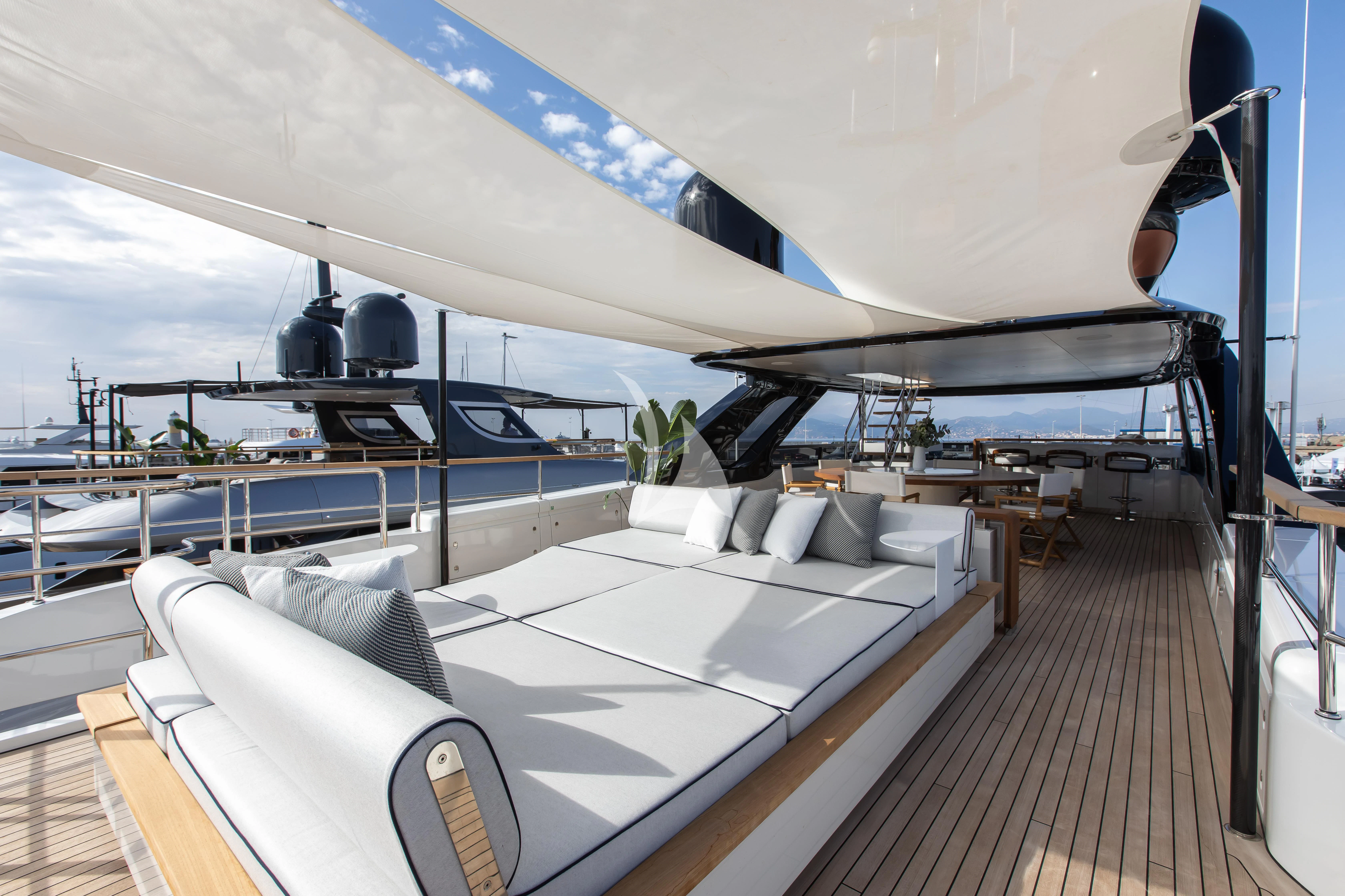 a deck with a large boat on it aboard HAYAT Yacht for Sale