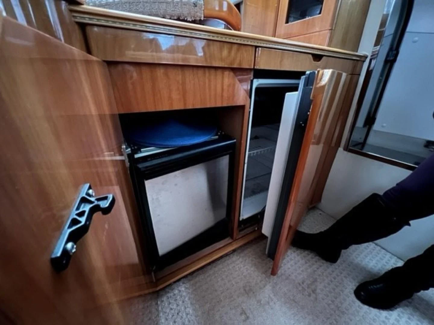 a kitchen with a wood cabinet aboard JOIE DU ROI Yacht for Sale