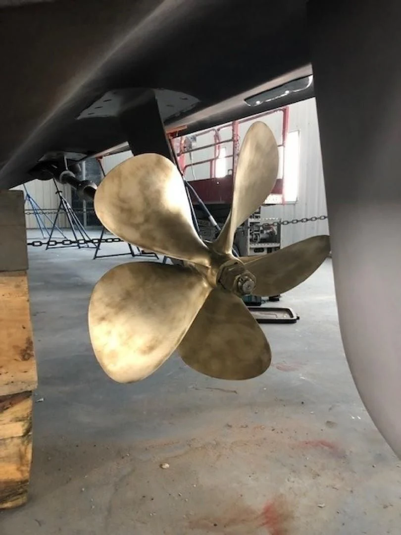 a propeller plane in a garage aboard JOIE DU ROI Yacht for Sale