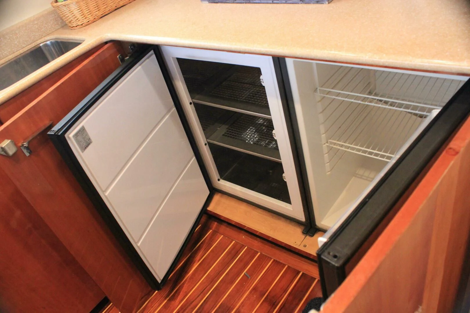 a kitchen with cabinets aboard JOIE DU ROI Yacht for Sale