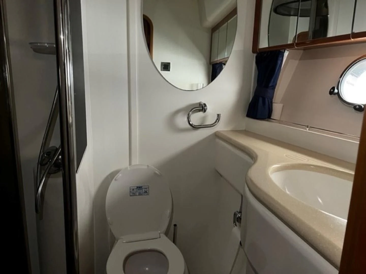 a bathroom with a toilet and sink aboard JOIE DU ROI Yacht for Sale