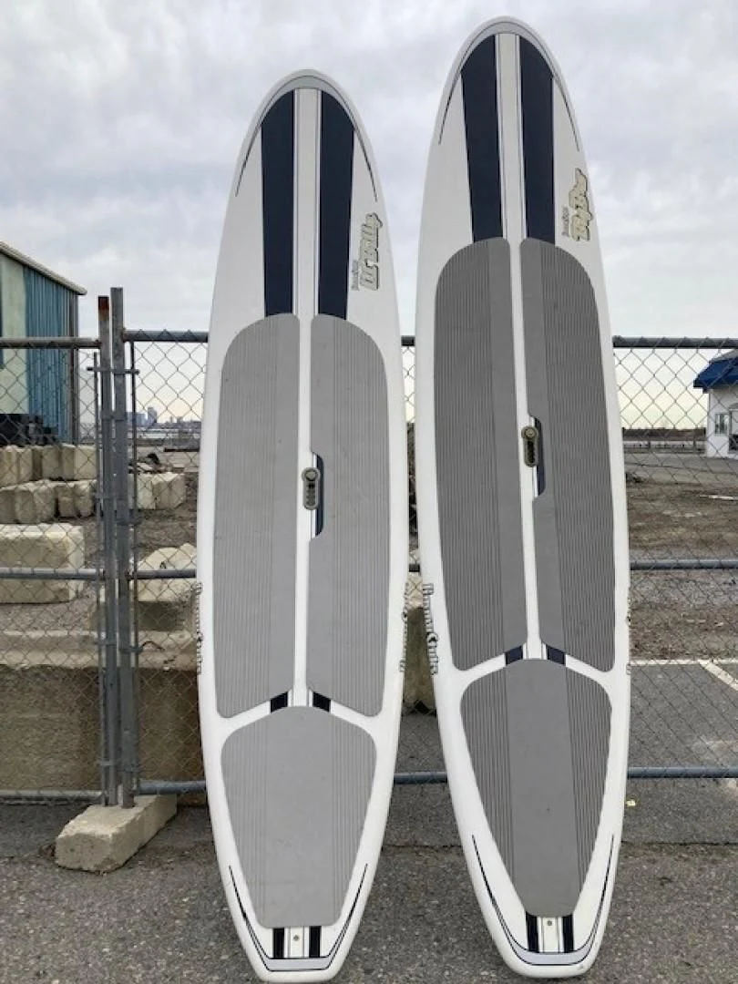 a couple of surfboards stand near each other aboard JOIE DU ROI Yacht for Sale