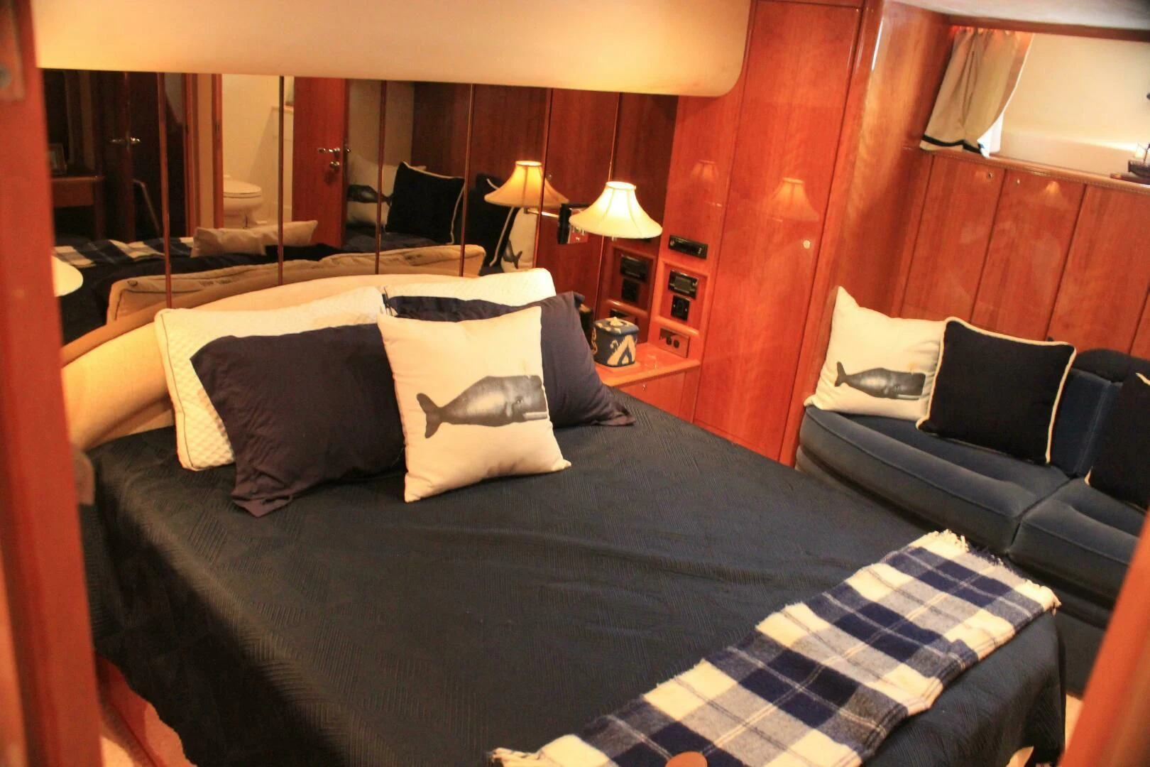 a bed with pillows aboard JOIE DU ROI Yacht for Sale