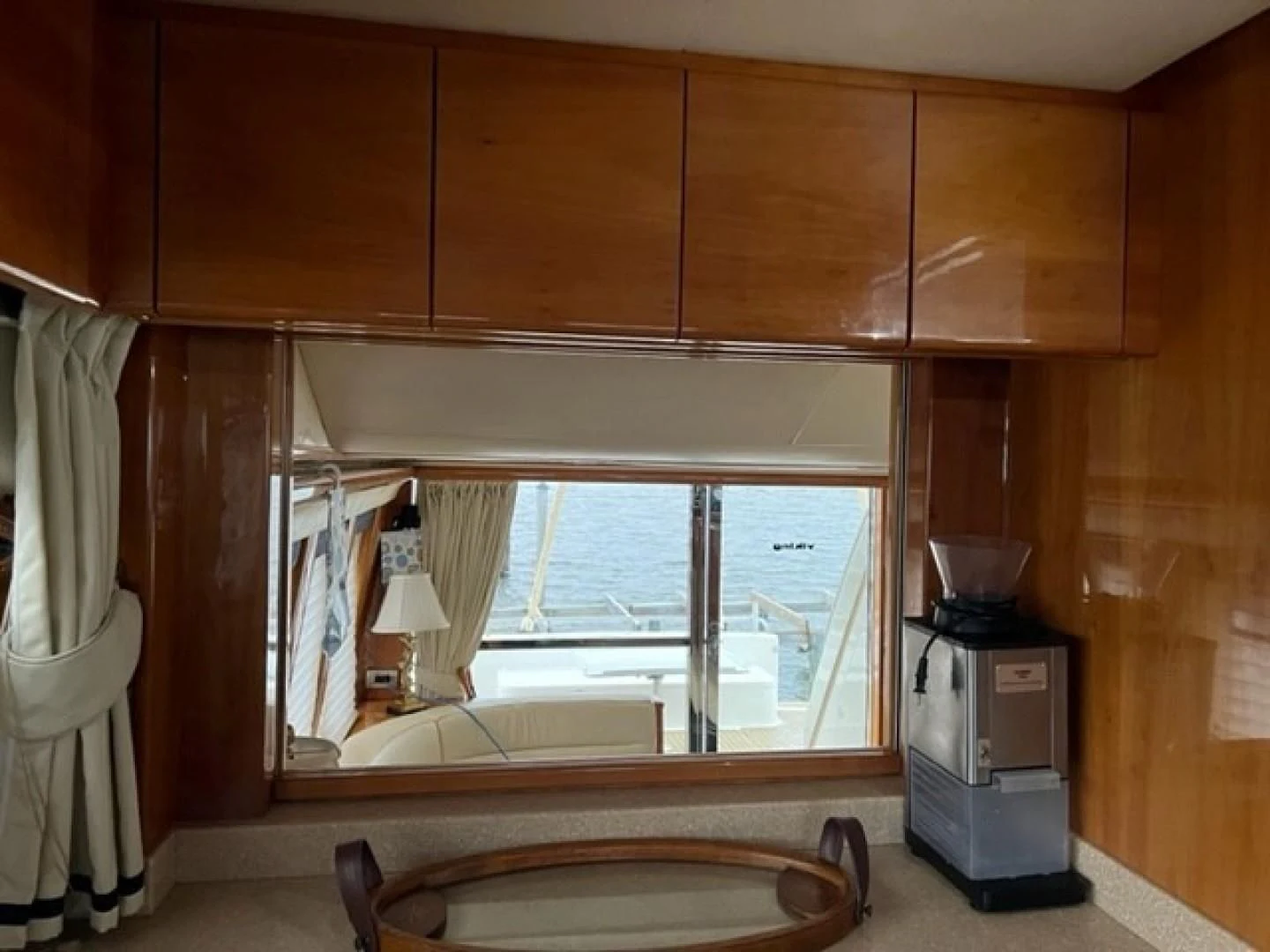 a kitchen with wooden cabinets aboard JOIE DU ROI Yacht for Sale