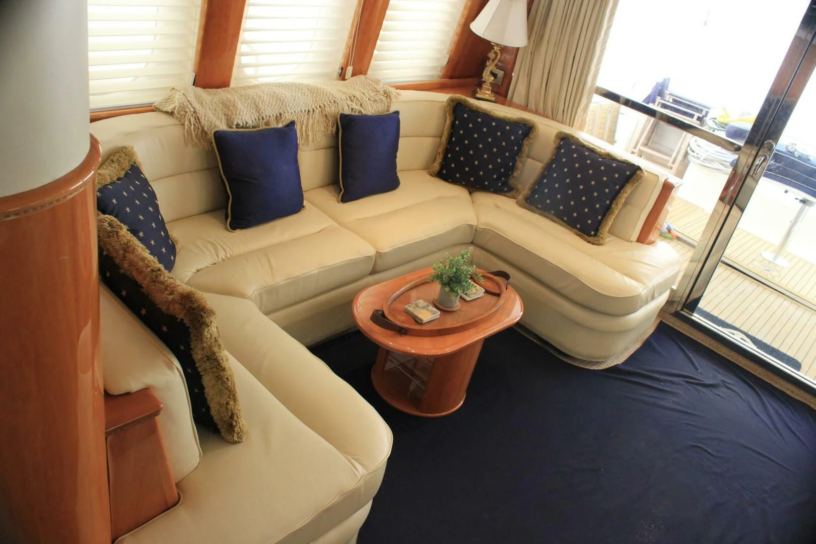 a living room with a couch and a coffee table aboard JOIE DU ROI Yacht for Sale