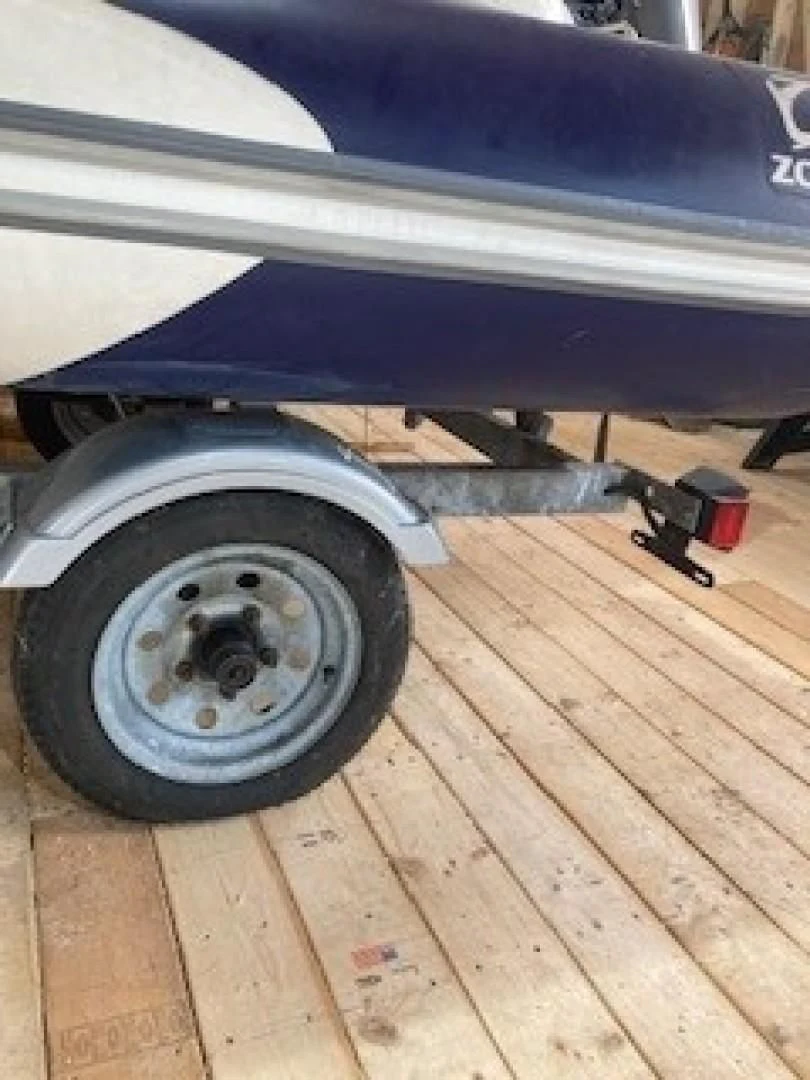 a blue and black tire on a wooden surface aboard JOIE DU ROI Yacht for Sale
