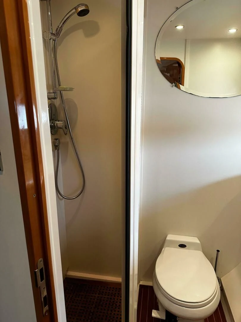 a bathroom with a toilet and a sink aboard JOIE DU ROI Yacht for Sale