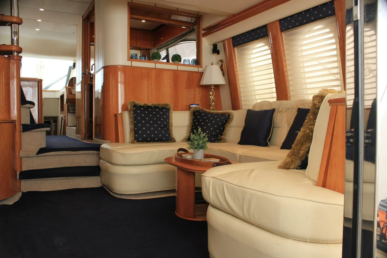 a living room with couches and a coffee table aboard JOIE DU ROI Yacht for Sale