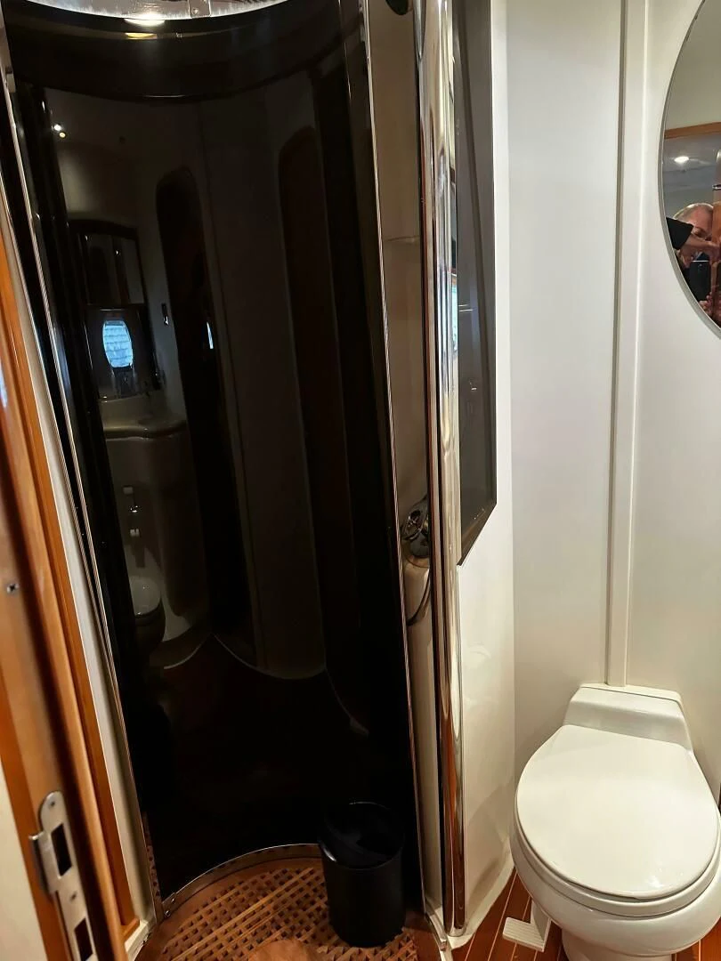 a toilet in a bathroom aboard JOIE DU ROI Yacht for Sale