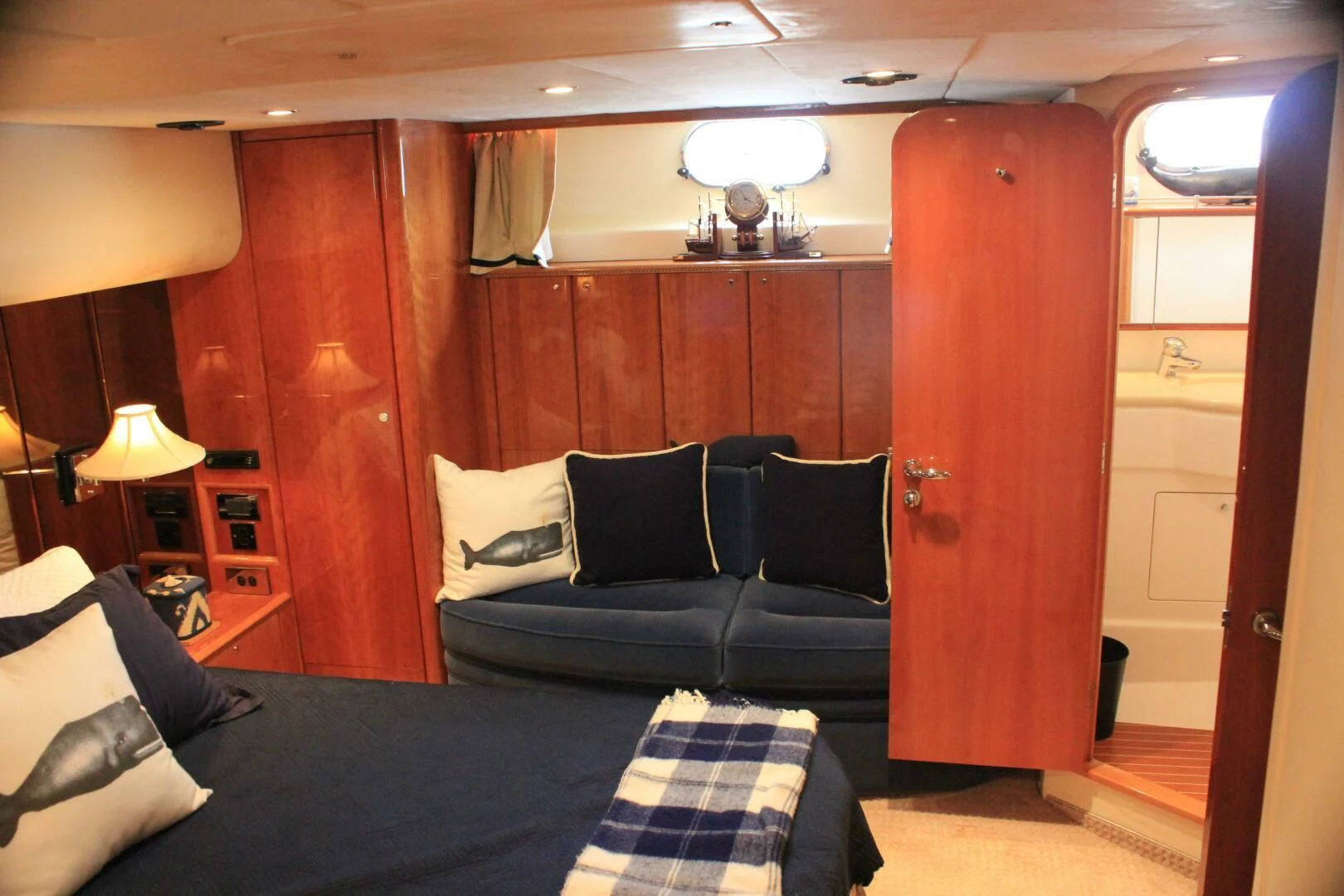 a room with a couch and a bed aboard JOIE DU ROI Yacht for Sale