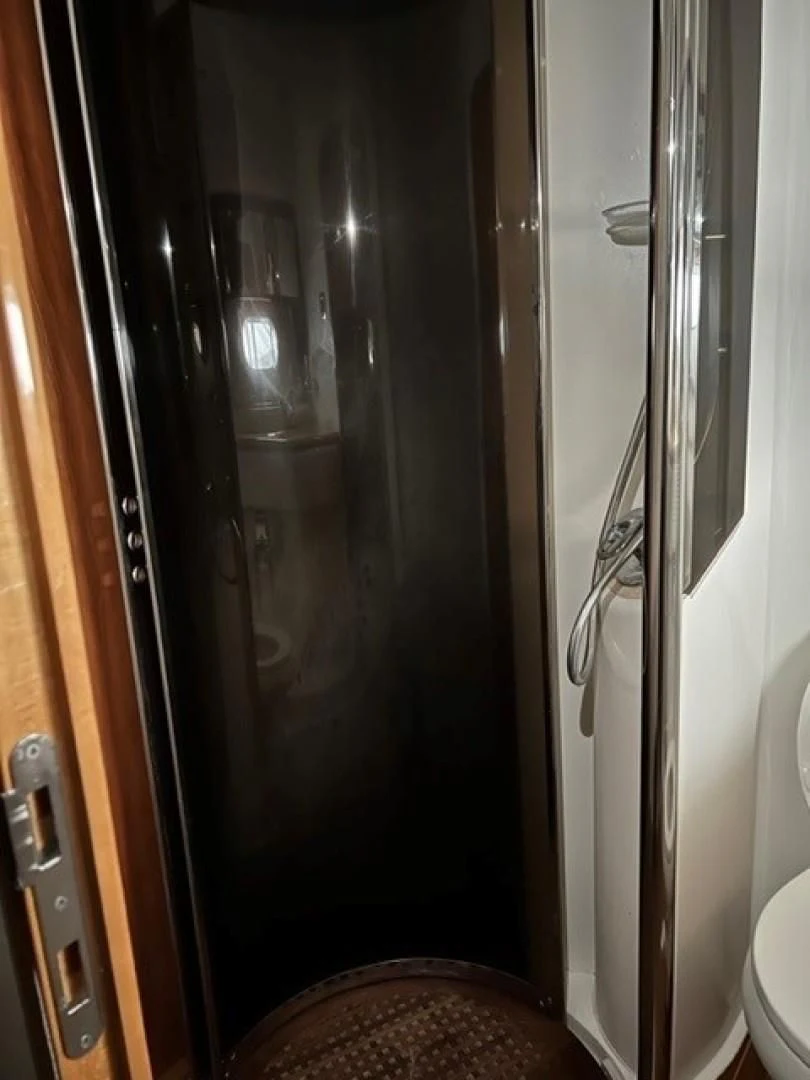 a shower with a glass door aboard JOIE DU ROI Yacht for Sale
