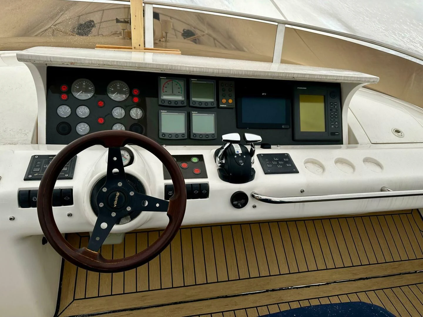 a control panel with a steering wheel aboard JOIE DU ROI Yacht for Sale