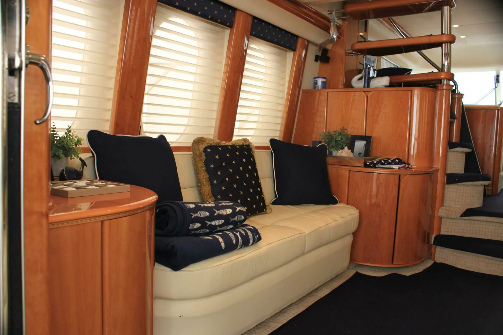 a living room with a couch and a desk aboard JOIE DU ROI Yacht for Sale
