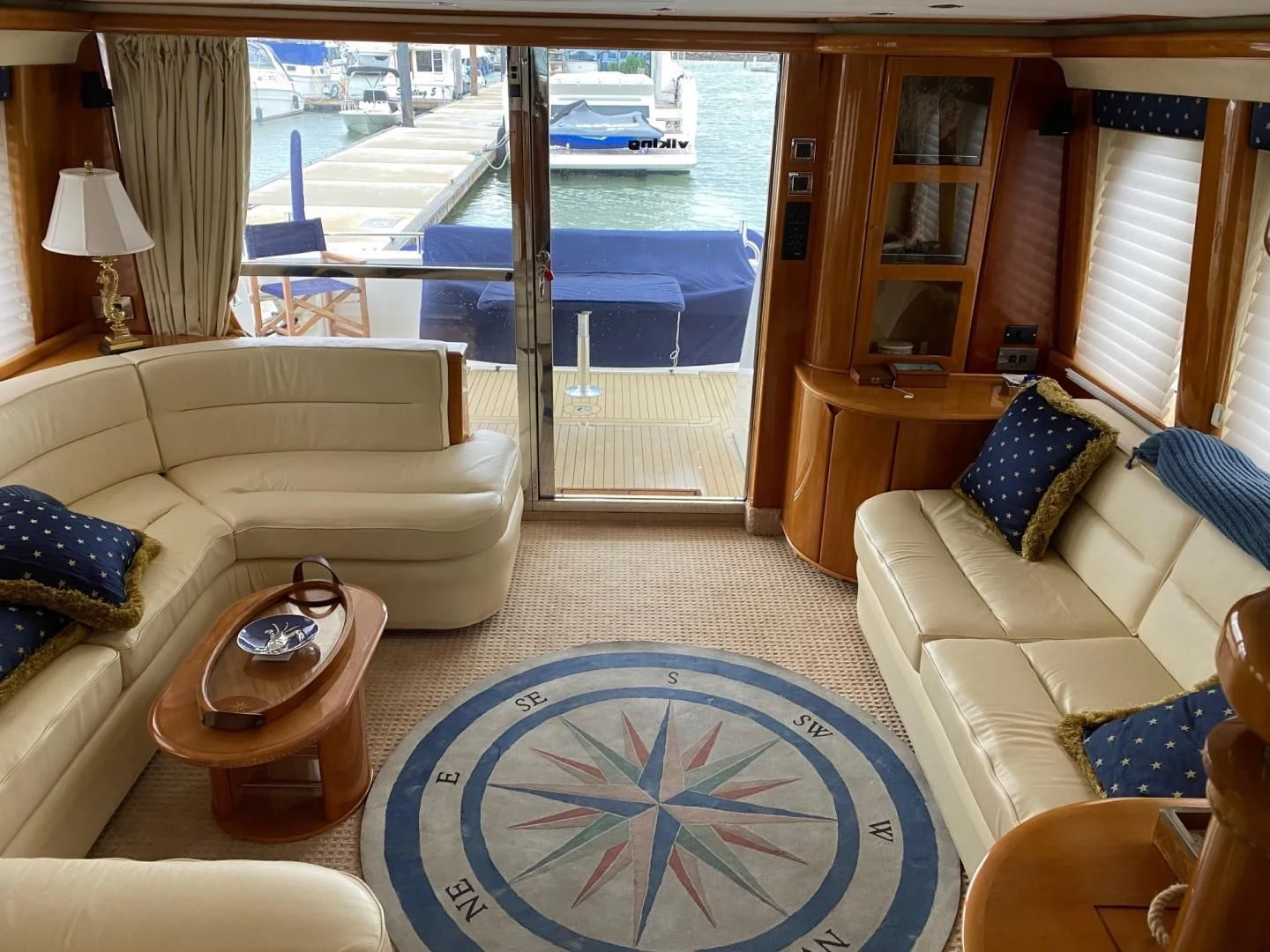 a living room with a large window aboard JOIE DU ROI Yacht for Sale