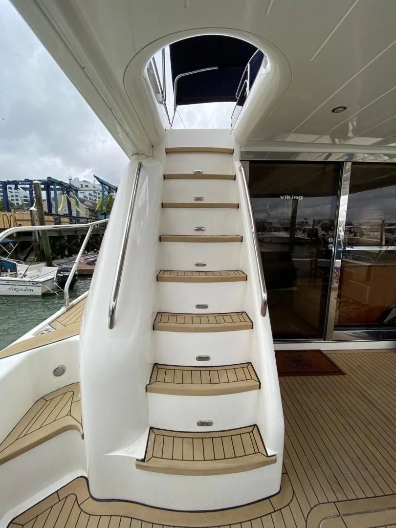 a large white boat in a room aboard JOIE DU ROI Yacht for Sale