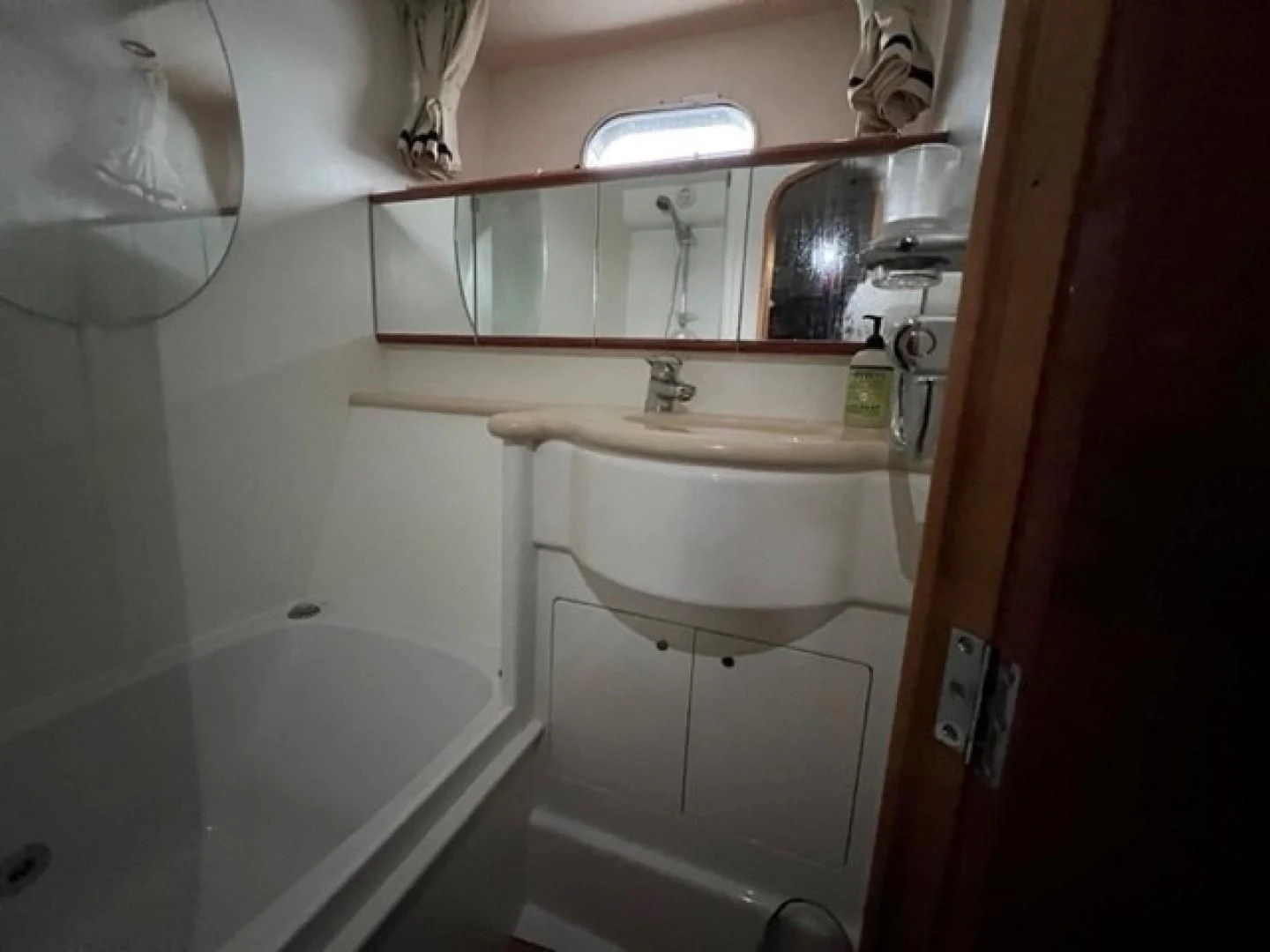 a bathroom with a sink and a mirror aboard JOIE DU ROI Yacht for Sale