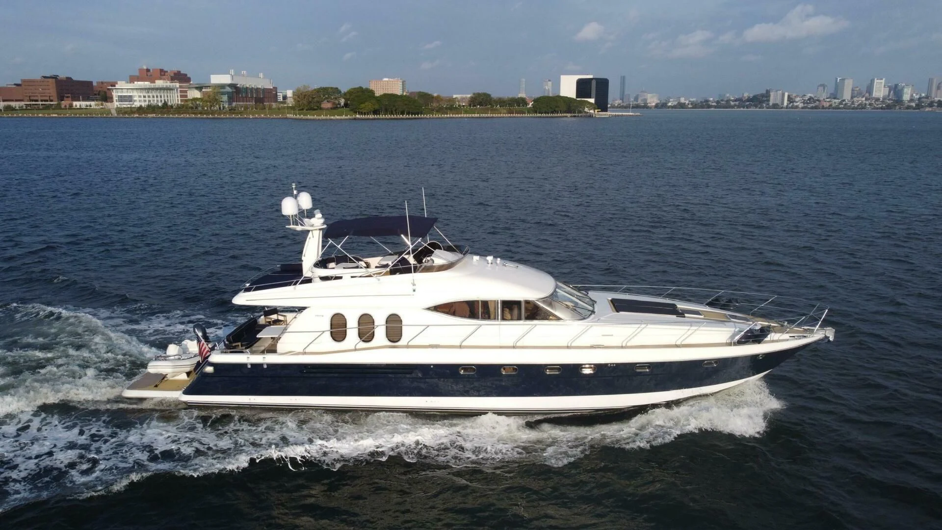 a white boat on the water aboard JOIE DU ROI Yacht for Sale