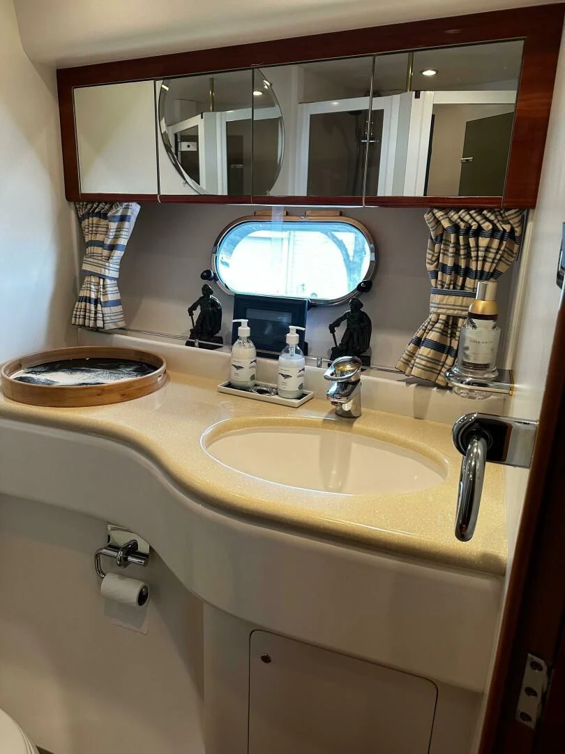 a bathroom with a large mirror aboard JOIE DU ROI Yacht for Sale