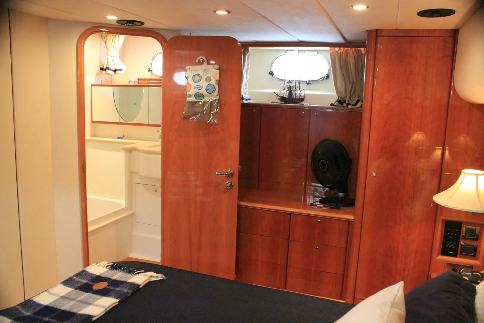 a bedroom with a wood cabinet aboard JOIE DU ROI Yacht for Sale