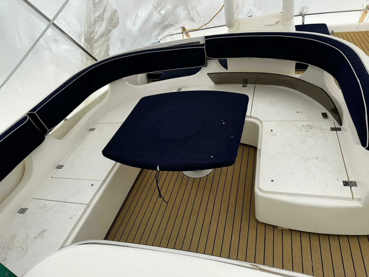 a black and blue graduation cap aboard JOIE DU ROI Yacht for Sale