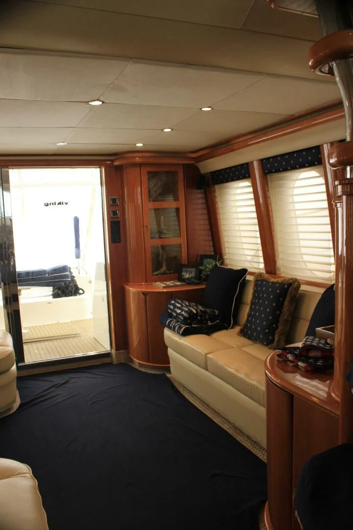 a living room with a large window aboard JOIE DU ROI Yacht for Sale