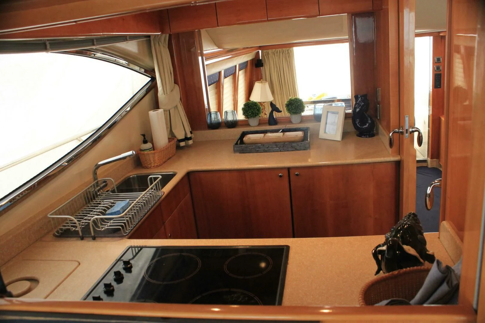 a kitchen with a sink and a window aboard JOIE DU ROI Yacht for Sale