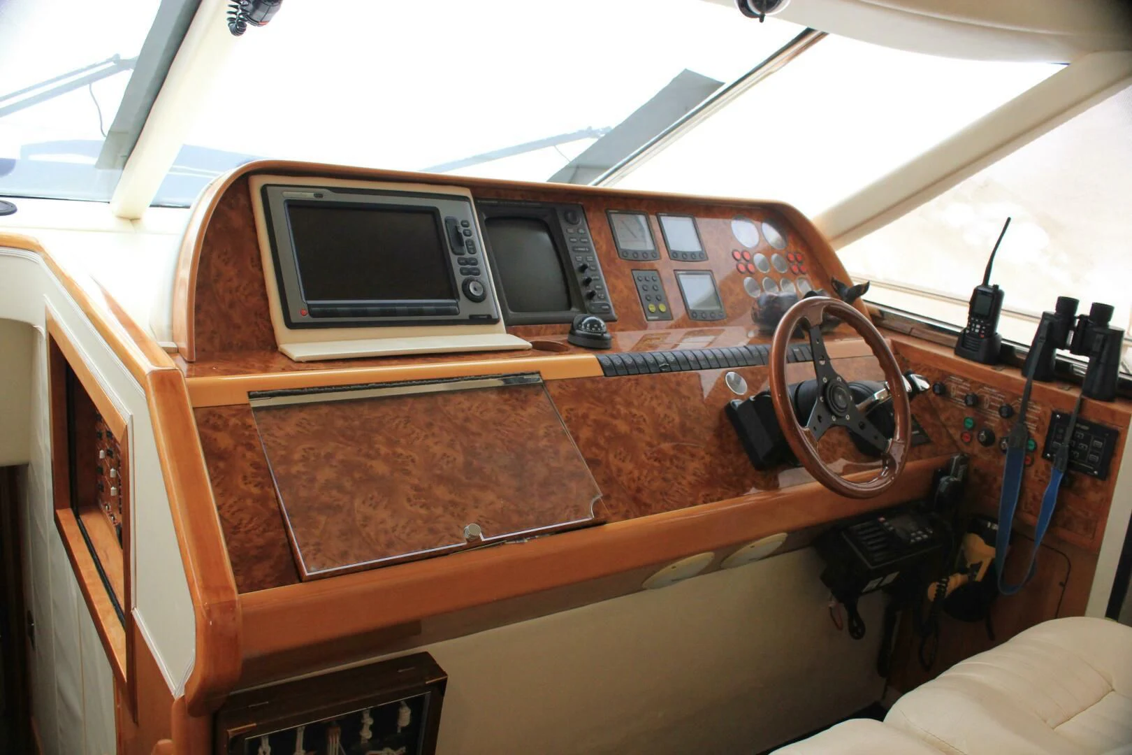 a wooden boat with a steering wheel aboard JOIE DU ROI Yacht for Sale