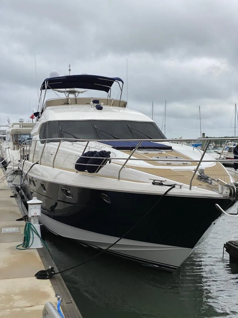 a white yacht docked aboard JOIE DU ROI Yacht for Sale