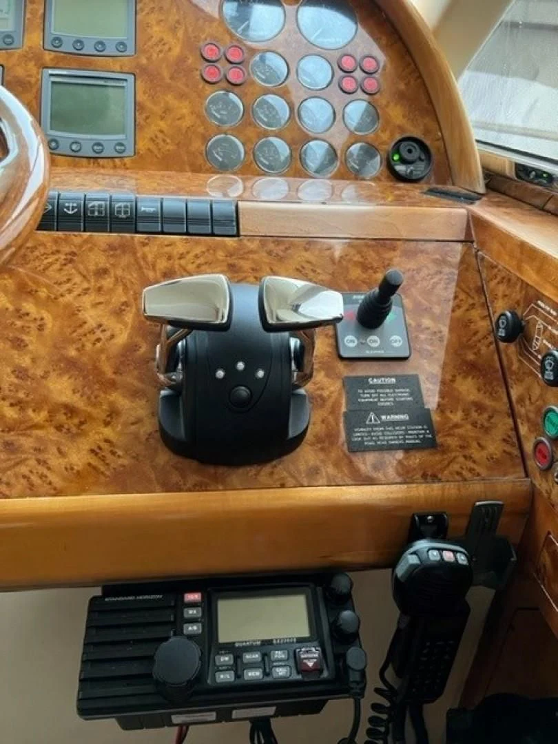 a camera on a table aboard JOIE DU ROI Yacht for Sale