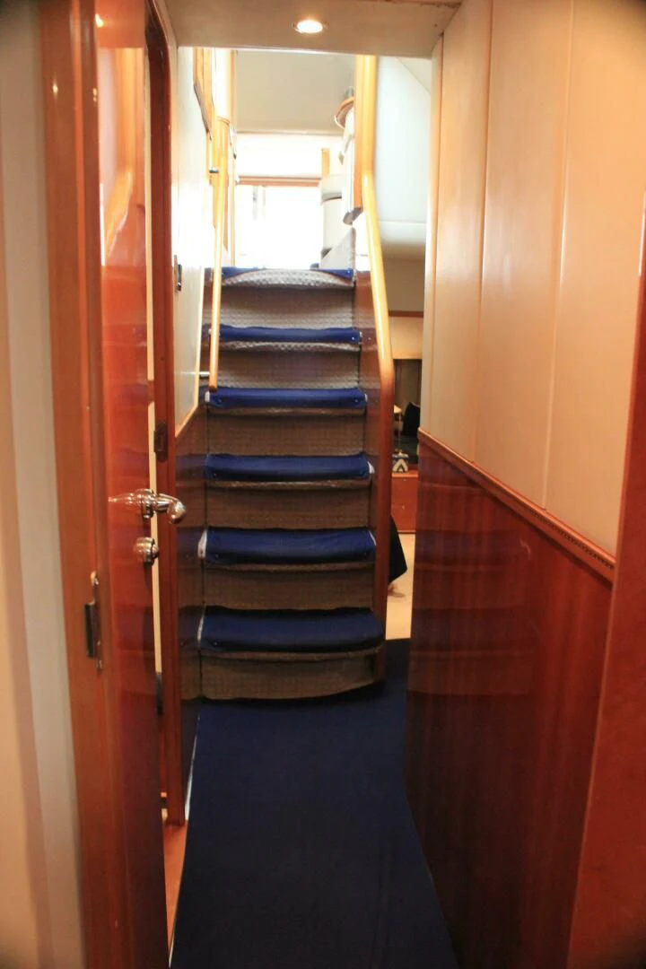 a door with a blue carpet aboard JOIE DU ROI Yacht for Sale