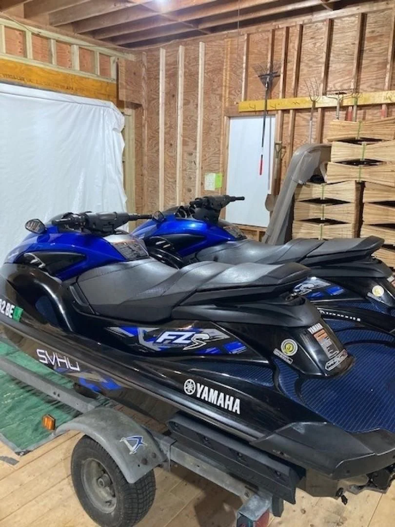 a blue motorcycle in a garage aboard JOIE DU ROI Yacht for Sale