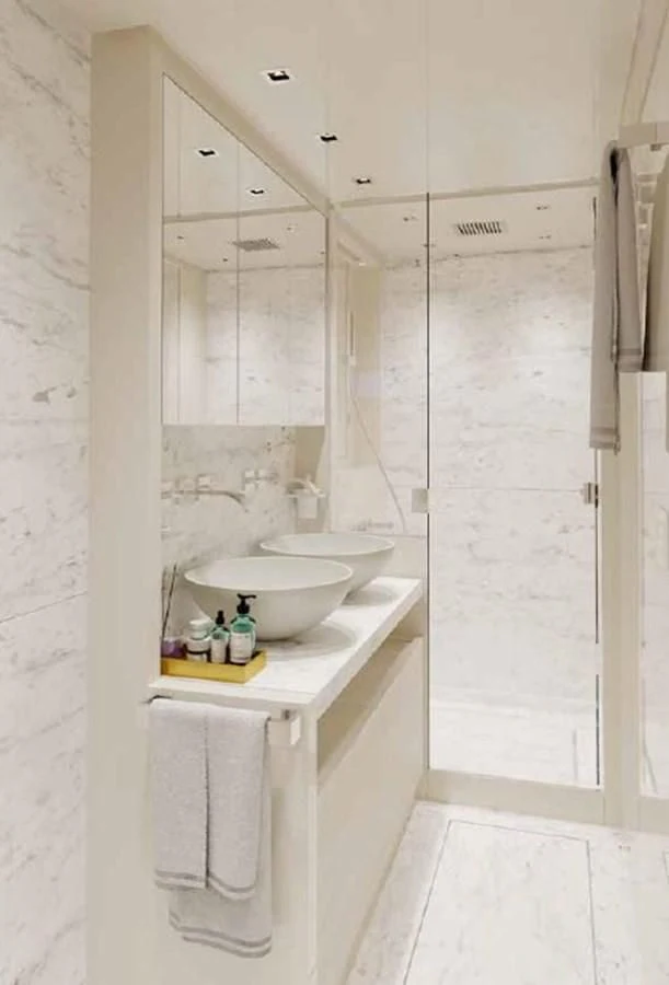 a bathroom with a sink and a mirror aboard ESSENZA Yacht for Sale