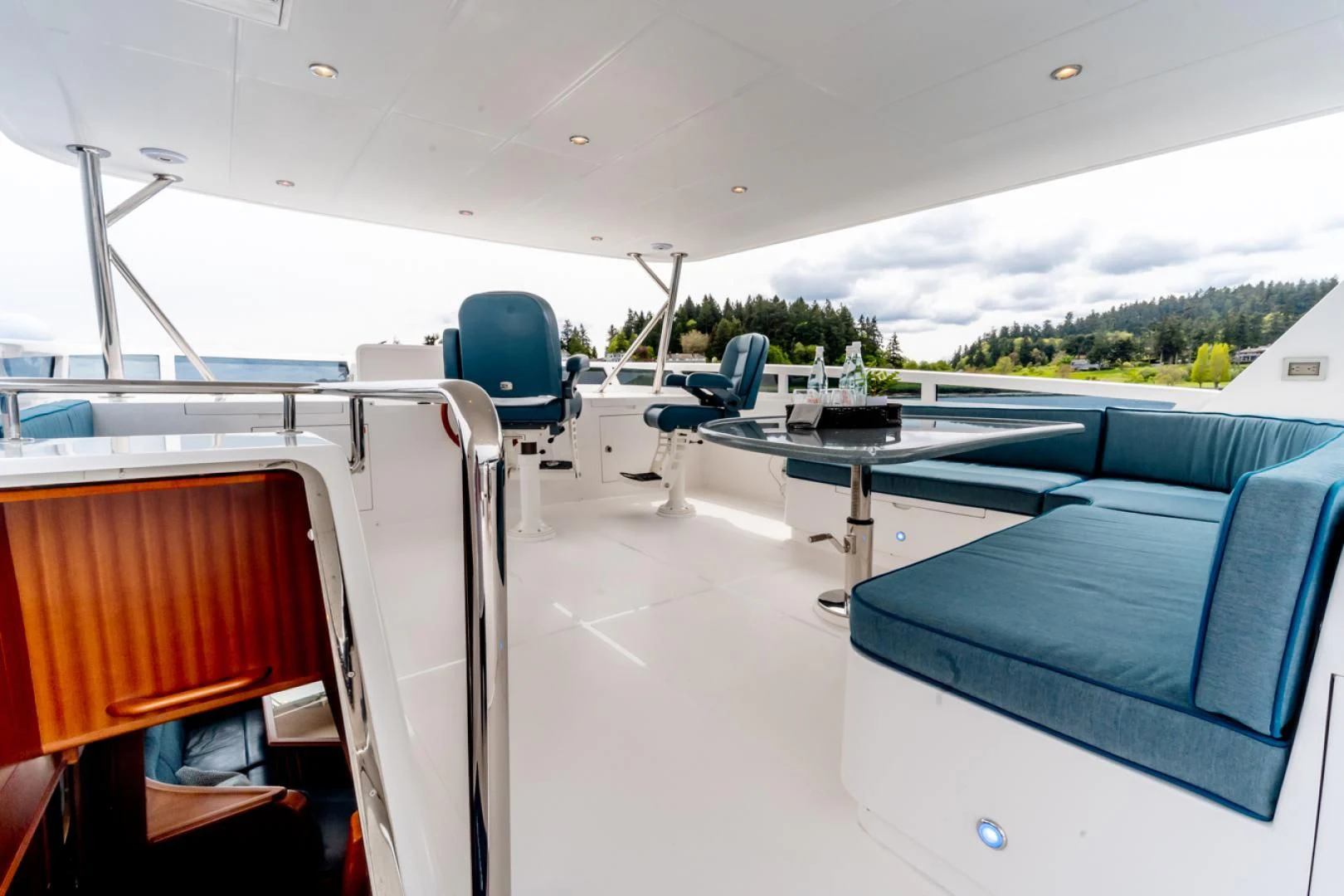 a room with a table and chairs aboard MAHALO Yacht for Sale