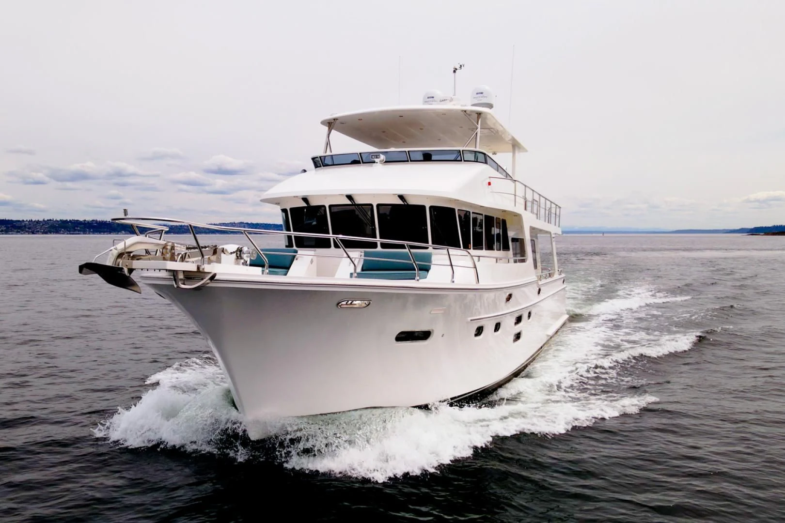 a white boat on the water aboard MAHALO Yacht for Sale