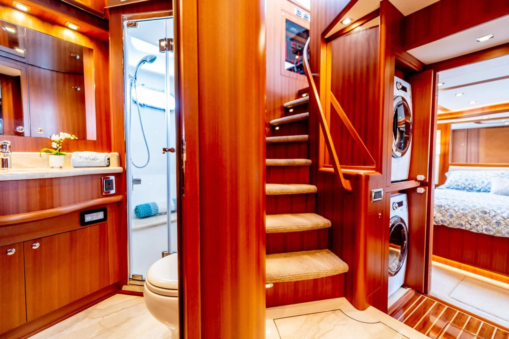 a room with a bed and a closet aboard MAHALO Yacht for Sale