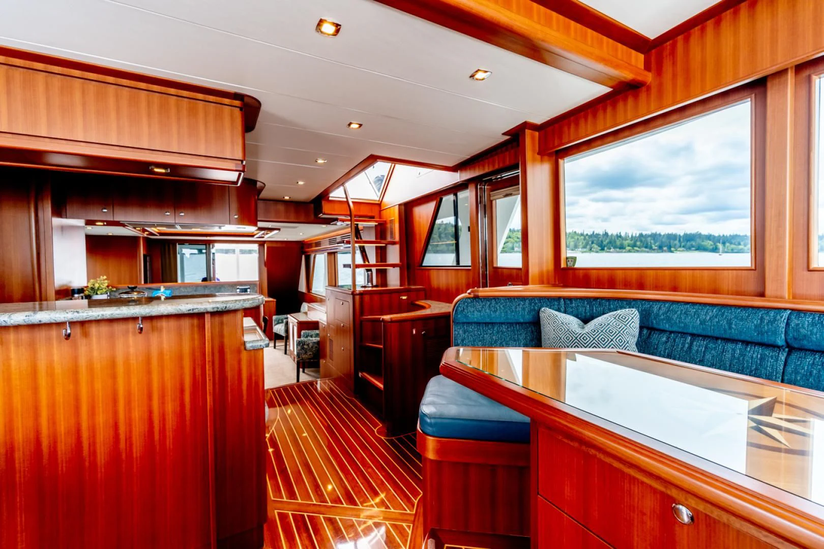 a room with a couch and a table aboard MAHALO Yacht for Sale