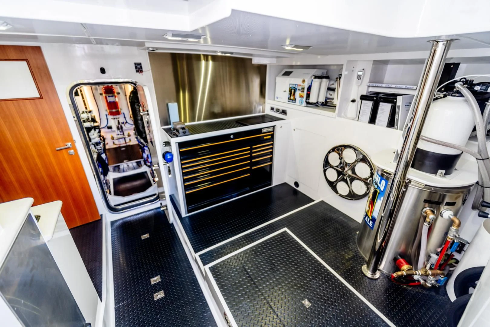 a room with a machine and a fan aboard MAHALO Yacht for Sale