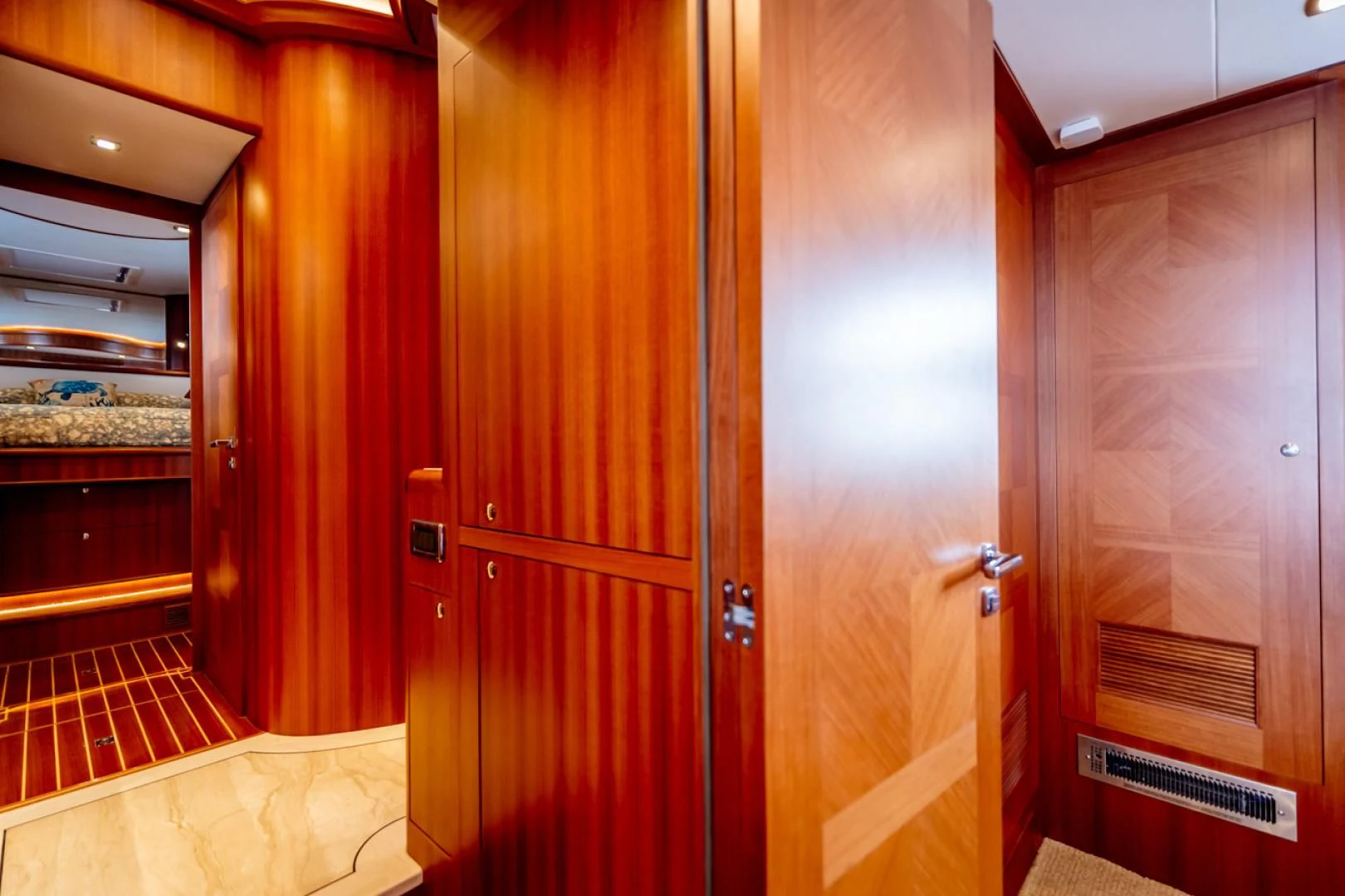 a room with wooden doors aboard MAHALO Yacht for Sale