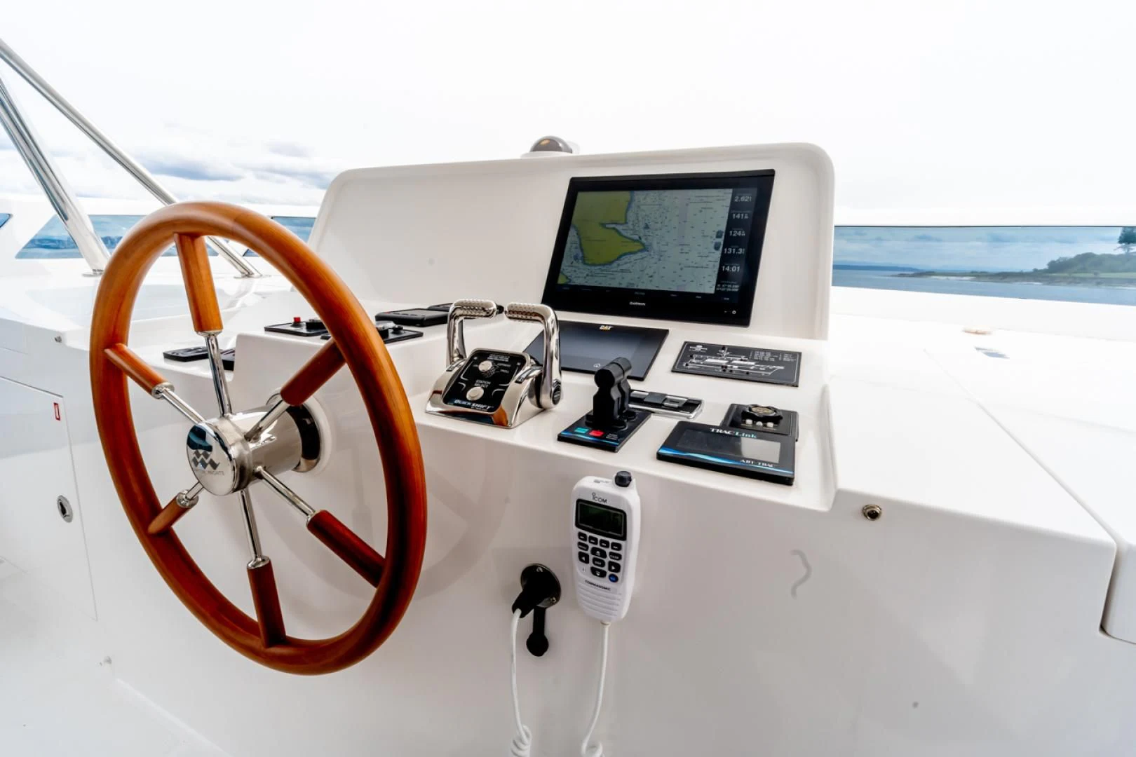 a steering wheel and a control panel on a boat aboard MAHALO Yacht for Sale