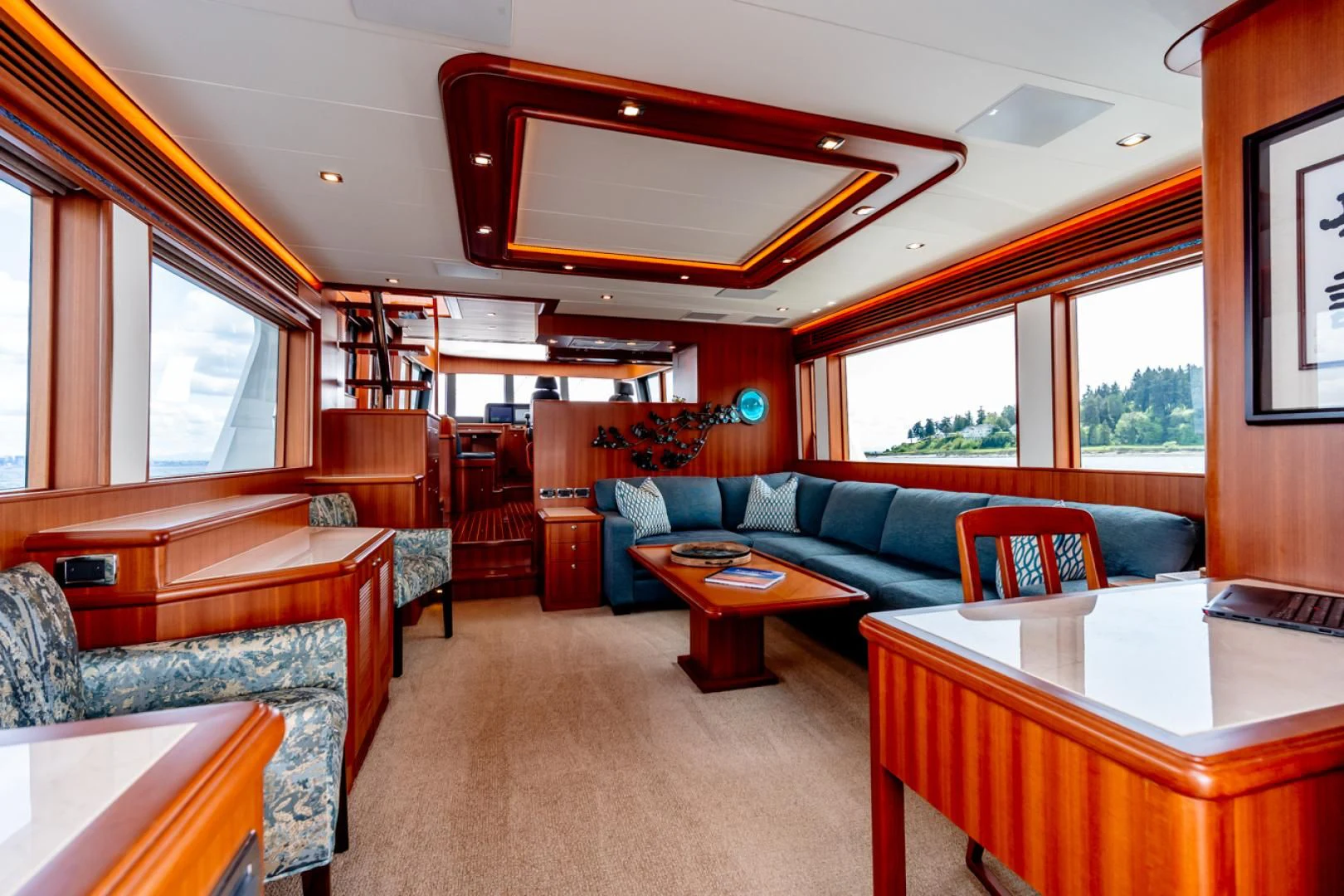a living room with a couch and a table aboard MAHALO Yacht for Sale